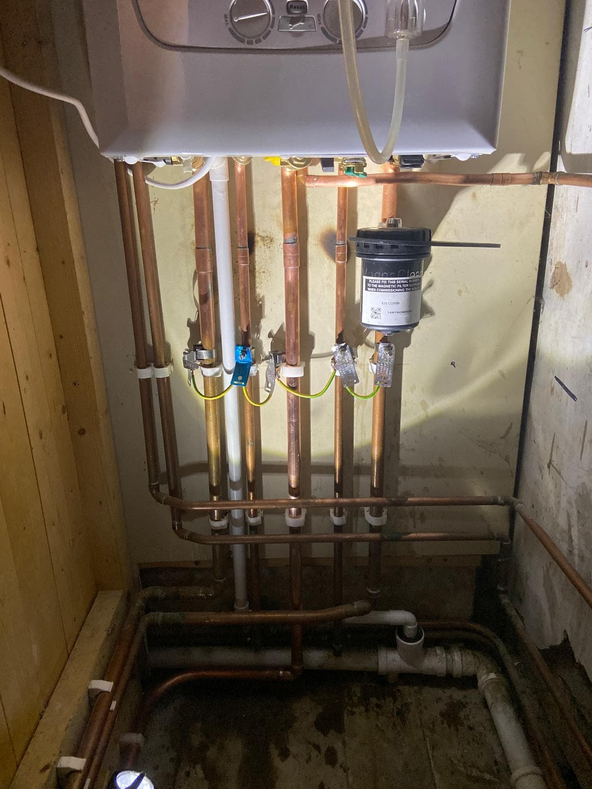 Copper pipework, earth bonding and MagnaClean magnetic filter beneath the new combi boiler