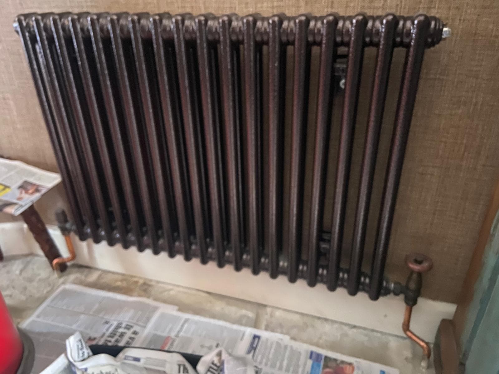 Refurbished cast iron column radiator with copper pipe drops and traditional valve