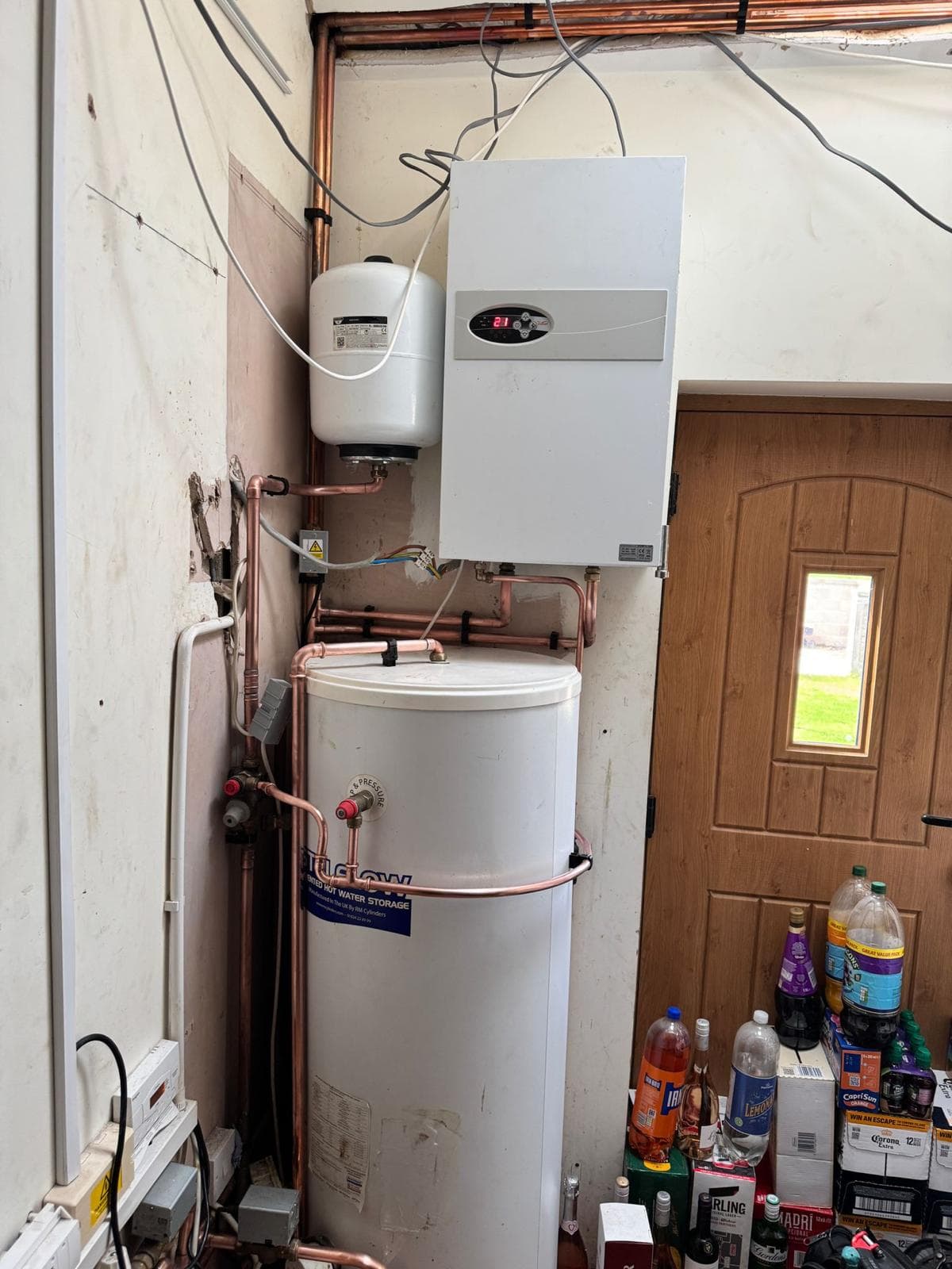 Finished install with the electric boiler mounted above the unvented cylinder and expansion vessel
