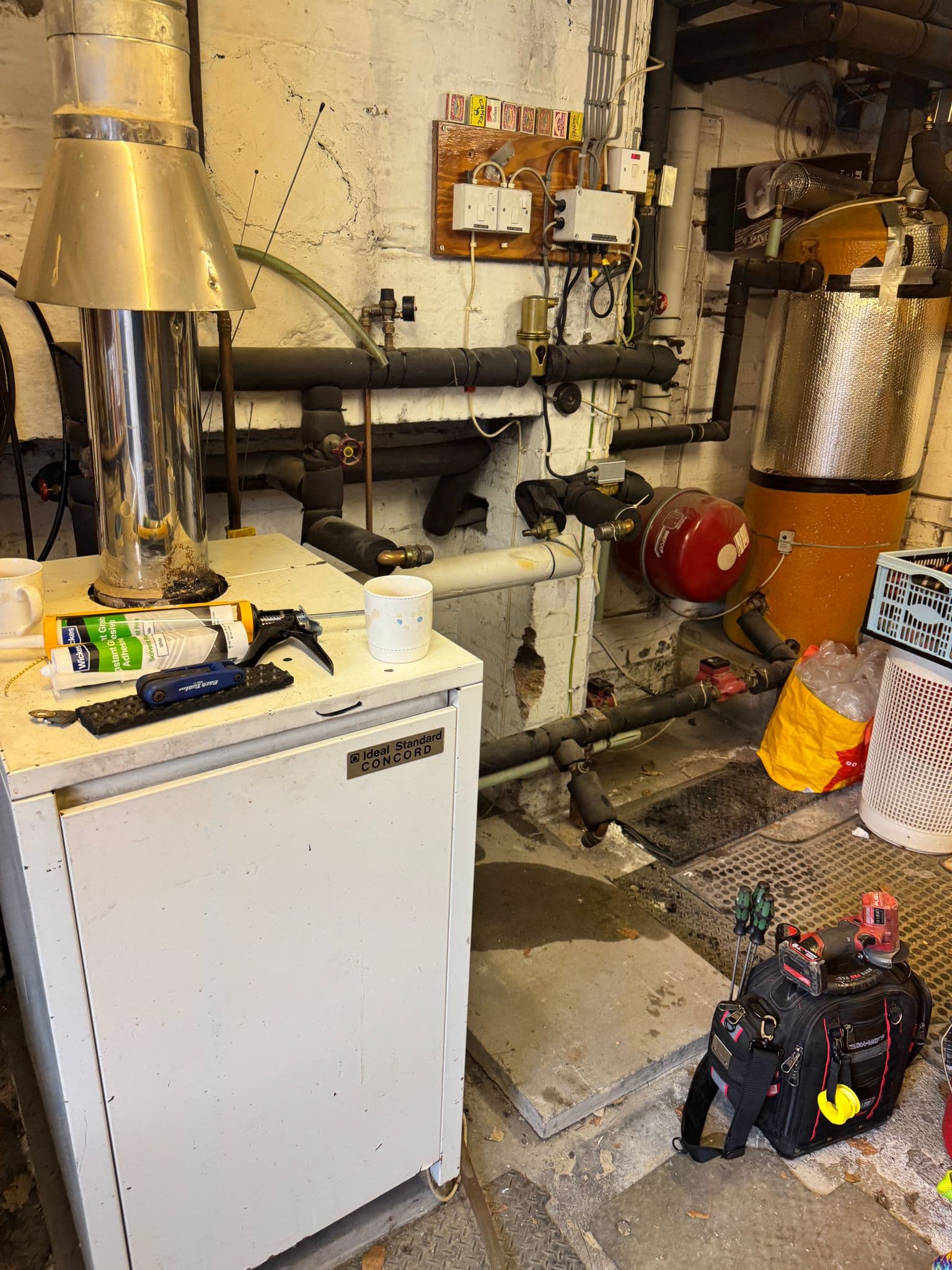An Ideal Standard Concord floor-standing boiler from 1988 being serviced