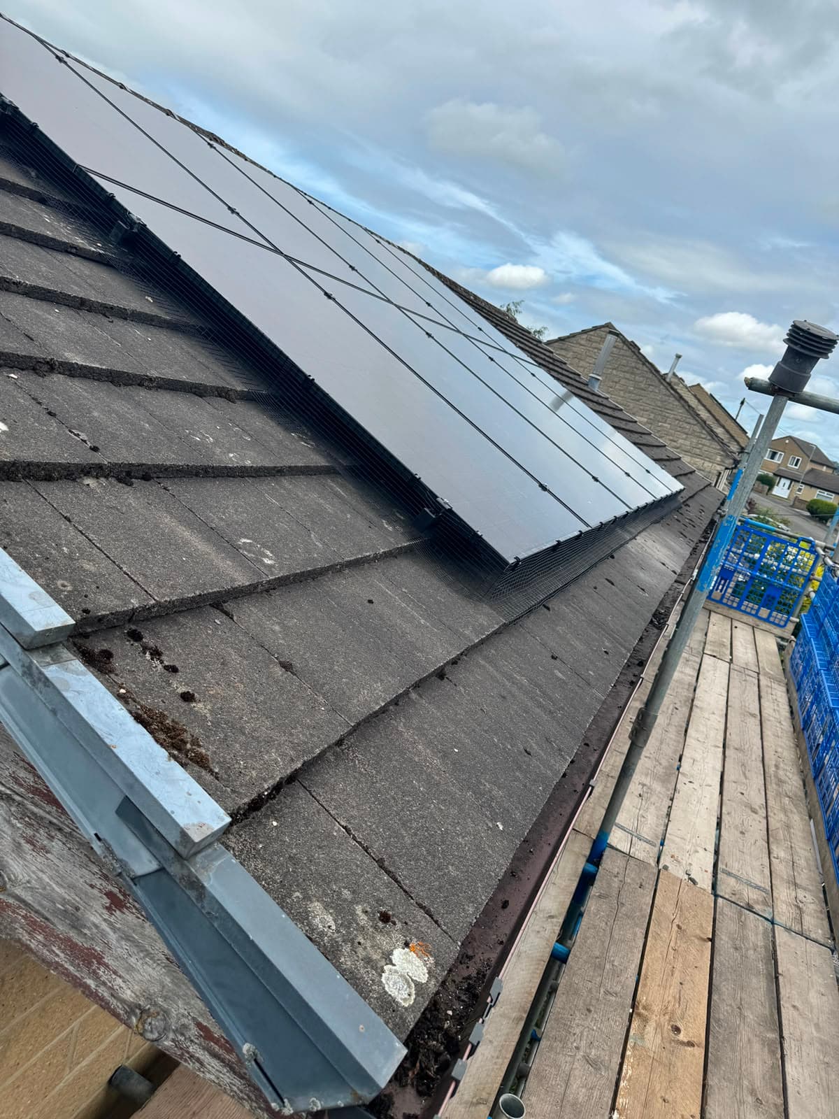 Bird-proof mesh running along the solar panel edge on roof tiles